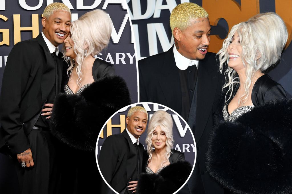 Cher and boyfriend Alexander ‘AE’ Edwards cozy up on ‘SNL 50’ purple carpet