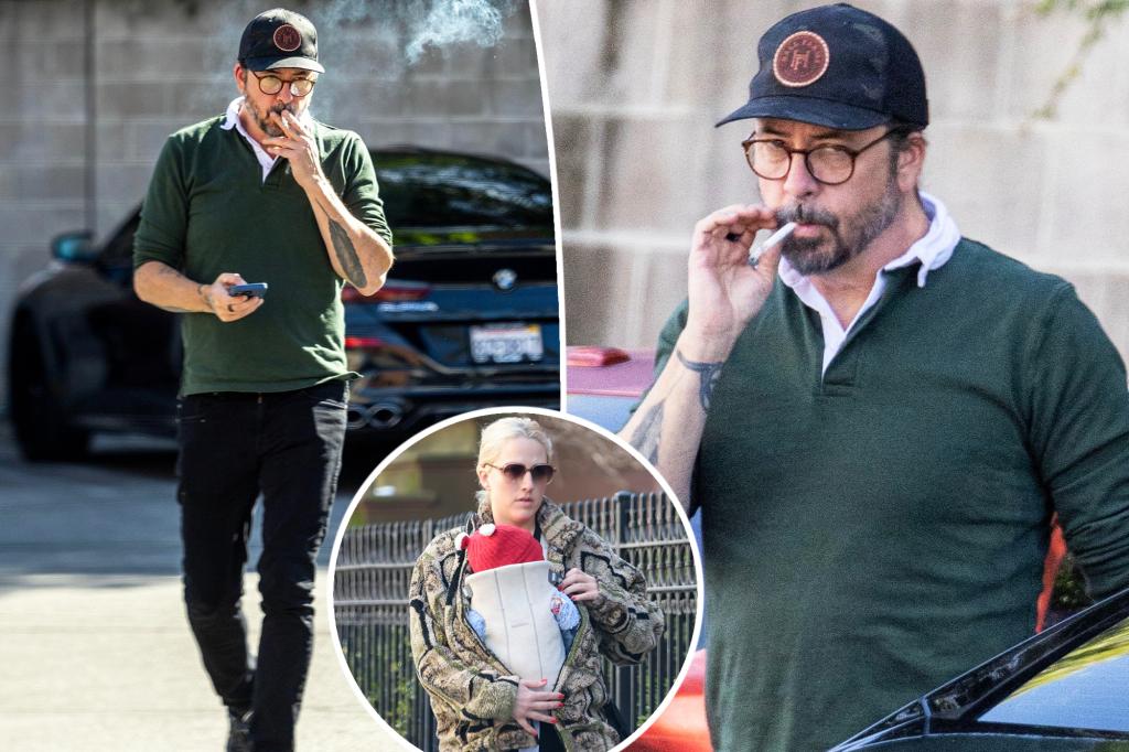 Dave Grohl puffs on a cigarette, seems confused after mom of his secret love youngster is revealed