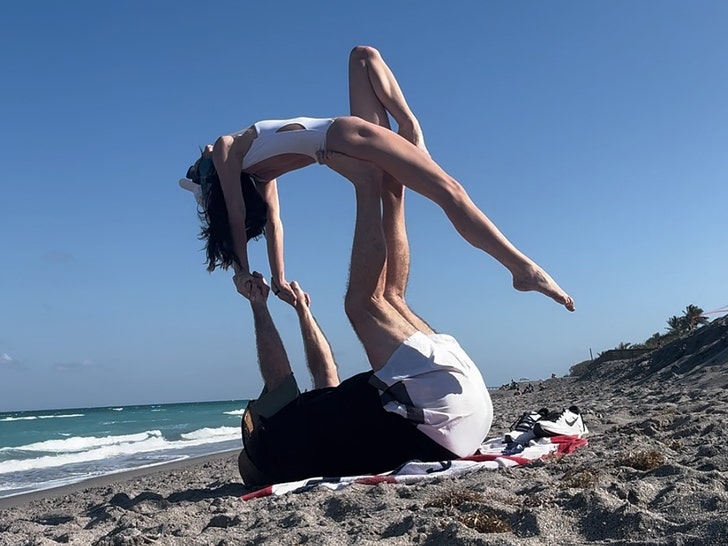 Invoice Belichick, GF Jordon Hudson Carry out Acrobatic Stunts on Seaside