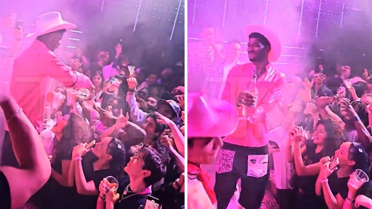 Lil Nas X Pours Pictures Down Followers’ Mouths at Album Launch Get together