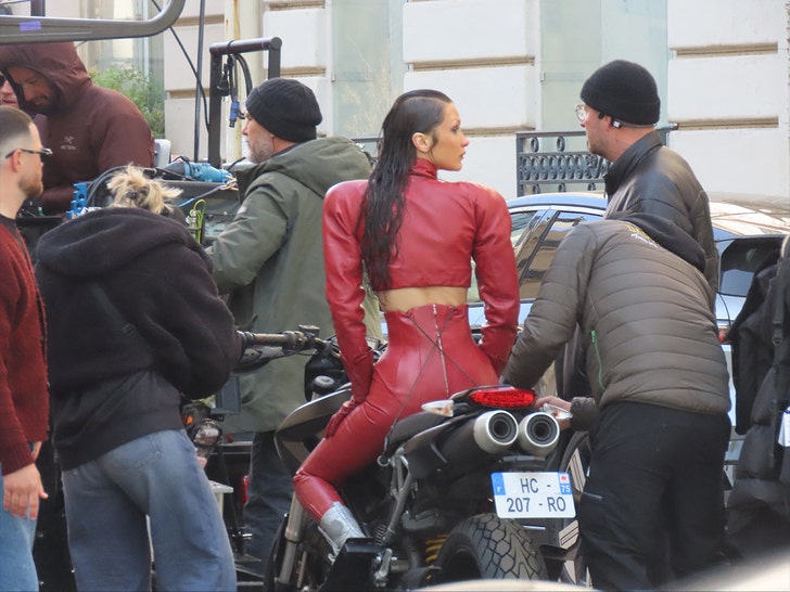 Bella Hadid Stuns in Crimson Leather-based Catsuit in Paris on ‘The Magnificence’ Set
