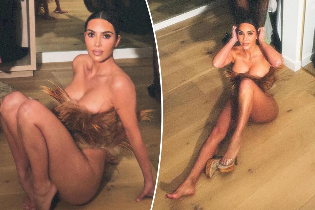 Kim Kardashian poses pantsless in nothing however a fur corset